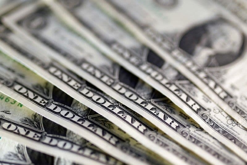 Dollar slips lower on dovish Fed expectations; sterling retains strength
