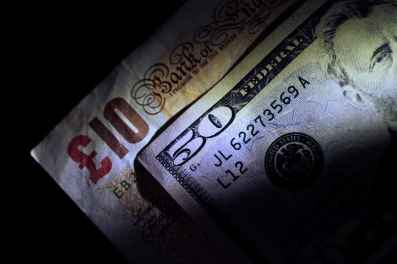 Dollar slips ahead of payrolls; sterling gains despite weak jobs data